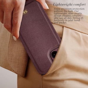 May include: A burgundy leather phone case with a gold embossed logo. The case is being held in a person's hand and is being placed into a pocket. The text "Lightweight comfort" is visible in the image. Enjoy premium protection without the bulk. Our lightweight, slim-profile design ensures comfortable use all day, fitting effortlessly in your hand and pocket.