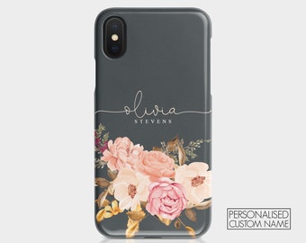 May include: A gray phone case with a floral design and the name "Olivia Stevens" written in a cursive font.