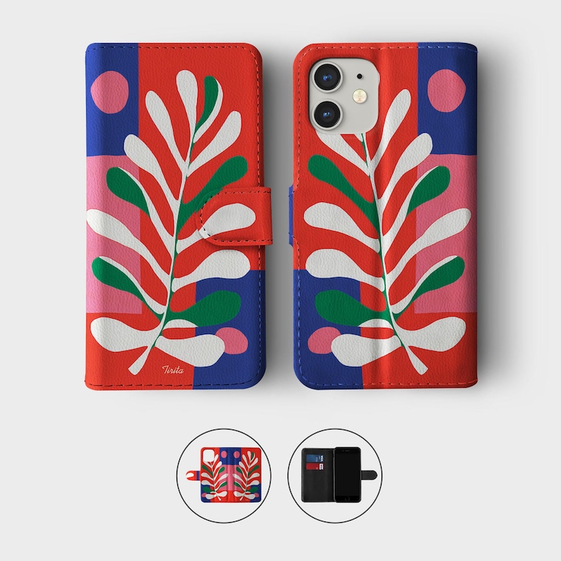 May include: A red, blue, and pink patterned phone case with a white and green leaf design. The case has a magnetic closure and a wallet design. The phone case is shown open and closed.