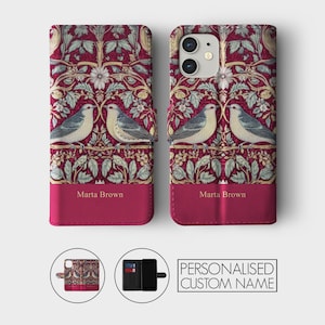 May include: A red phone case with a floral pattern and two birds. The case has a flap that folds over the phone and has a space for a credit card. The case is personalized with the name "Marta Brown".