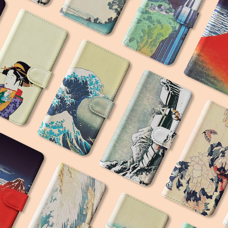 May include: A collection of phone cases with various designs, including a woman in a kimono, a wave, a cityscape, a floral pattern, and a mountain range. The cases are all made of a durable material and have a sleek, modern look.