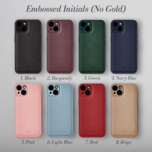 May include: Eight different colored phone cases with embossed initials. The cases are made of leather and come in black, burgundy, green, navy blue, pink, light blue, red, and beige.
