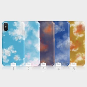 May include: Five different phone cases with watercolor cloud designs. The cases are all white with a variety of colors, including blue, pink, orange, and yellow. The cases are numbered 1 through 5.
