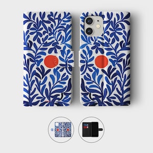 May include: A white phone case with a blue floral pattern and a red circle. The case is designed to fold open and closed, with a magnetic clasp. The case is shown open and closed, with a small image of the case and a phone with cards.