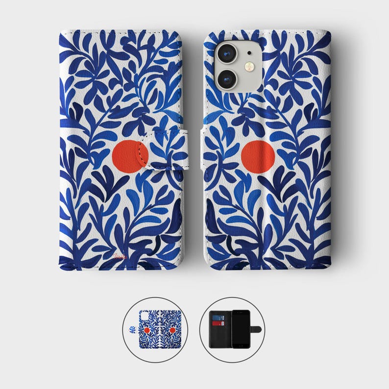 May include: A white phone case with a blue floral pattern and a red circle. The case is designed to fold open and closed, with a magnetic clasp. The case is shown open and closed, with a small image of the case and a phone with cards.