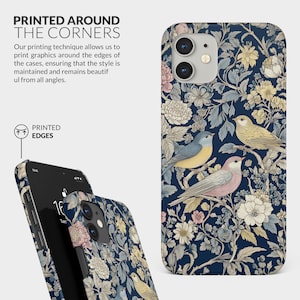 May include: A phone case with a floral pattern featuring birds and flowers on a dark blue background. The case is printed around the edges, ensuring the design is visible from all angles. The text "PRINTED EDGES" is visible on the case.