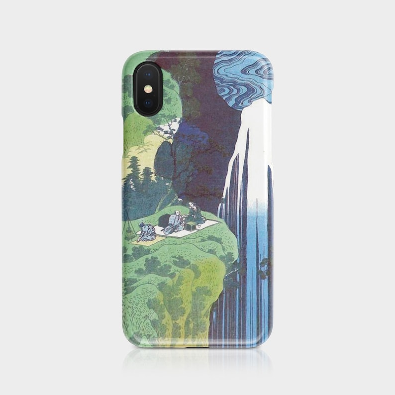 May include: A phone case featuring a Japanese woodblock print of a waterfall scene. The design includes a waterfall, figures on a cliff, and a blue and green color palette. The case is designed to fit a smartphone.