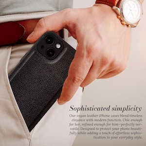 May include: A black leather iPhone case with a textured finish. The case has a camera cutout and is shown in a person's pocket.