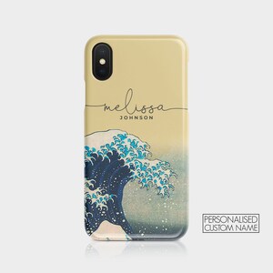 May include: A personalized phone case with a beige background and a blue and white wave design. The text "melissa JOHNSON" is written in black cursive script on the top of the case.