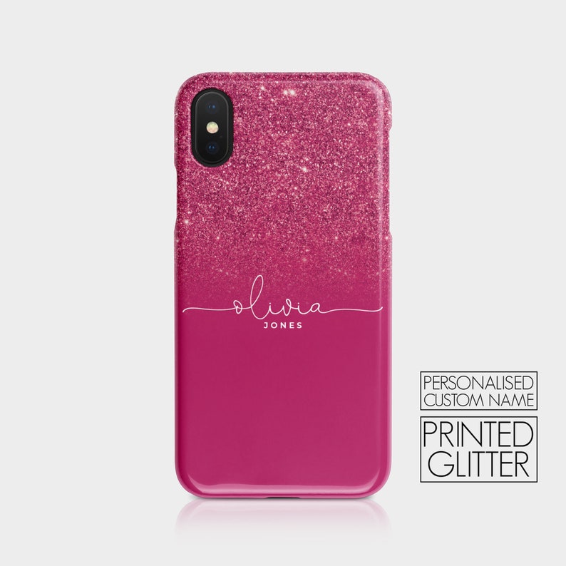 K&ouml;nnte beinhalten: Rosa glitzernder Handyh&uuml;lle mit einem wei&szlig;en Ombre-Effekt und dem Namen "Olivia Jones" auf der R&uuml;ckseite. Die H&uuml;lle ist personalisiert mit einem individuellen Namen und verf&uuml;gt &uuml;ber gedruckten Glitzer.