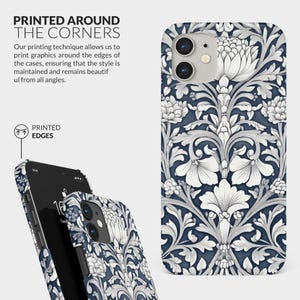 May include: A phone case with a white floral pattern on a dark blue background. The pattern is printed around the edges of the case. The case is designed for an iPhone.