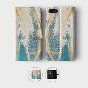 May include: A white leather phone case with a blue and gold wave pattern. The case is open to show the inside, which has slots for cards and a pocket for cash.
