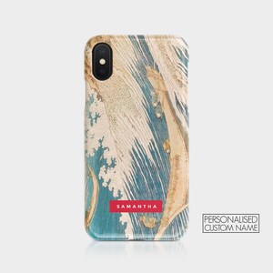 May include: A blue and beige phone case with a wave pattern and the name "SAMANTHA" printed in red. The case is designed for an iPhone.