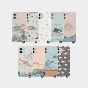May include: Nine different phone cases featuring various dinosaur illustrations. The cases are all white with a light blue, pink, or grey background. The dinosaurs are depicted in a cartoon style and include a stegosaurus, a pterodactyl, and a tyrannosaurus rex.