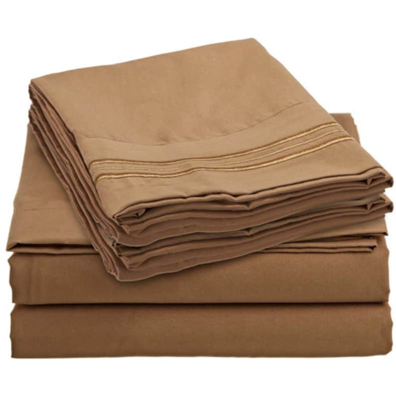 May include: A stack of brown bed sheets with gold trim. The sheets are folded neatly and are ready to be used.