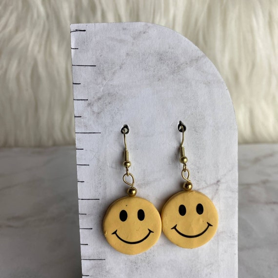 Face deals dangle earrings