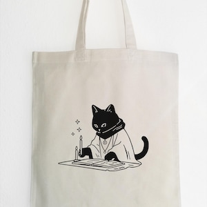 Chat noir avec livre magique - Sac en tissu mystique, sac en jute de coton, sac fourre-tout pour chat noir, sac de cartes pour chat et tarot, impression linogravée