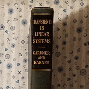 May include: A black book titled "Transients in Linear Systems" by Gardner and Barnes, Volume 1. The book is published by Wiley.