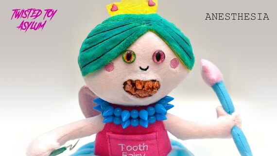 creepy teeth doll