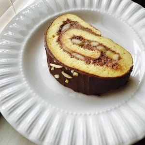 Swiss roll nutella chocolate filling with vanilla sponge cake