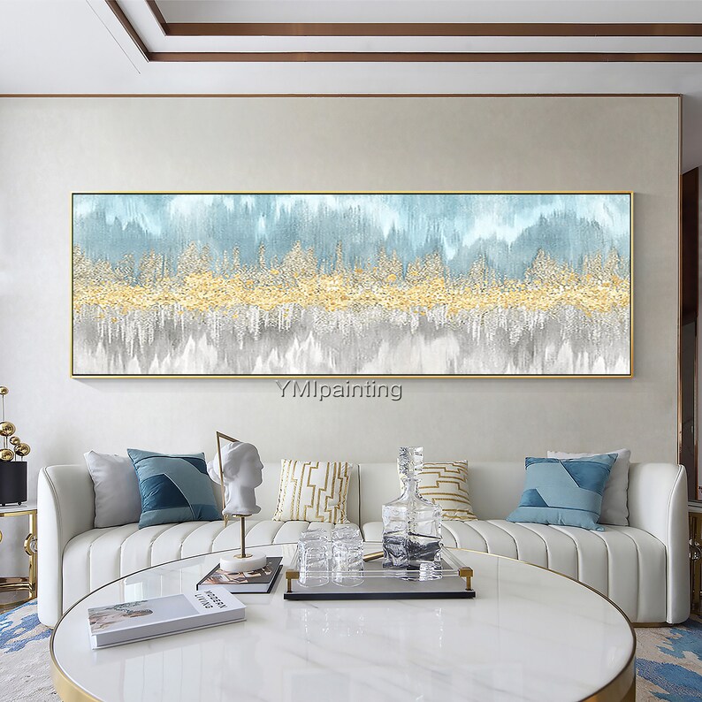 May include: Abstract painting with a blue, white, and gold color scheme. The painting features a series of vertical lines that create a sense of movement and depth. The gold accents add a touch of luxury and sophistication.