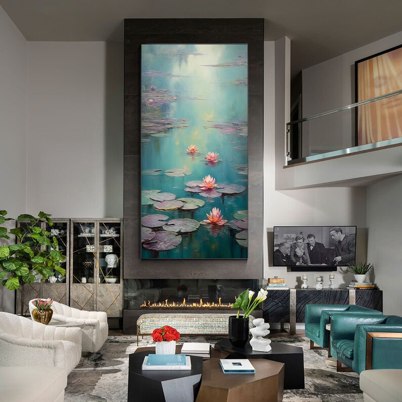May include: A painting depicting pink water lilies on a pond with green lily pads. The painting is framed and hanging on a wall in a contemporary living room.