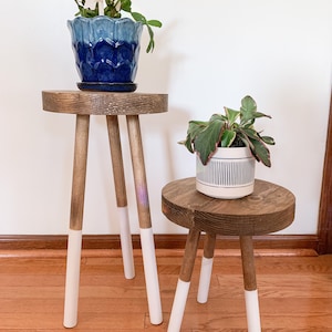 Elevate your decor with our modern wood plant stand – a versatile three-leg accent stool that doubles as an indoor plant stand. The perfect fusion of style and functionality for your space.
