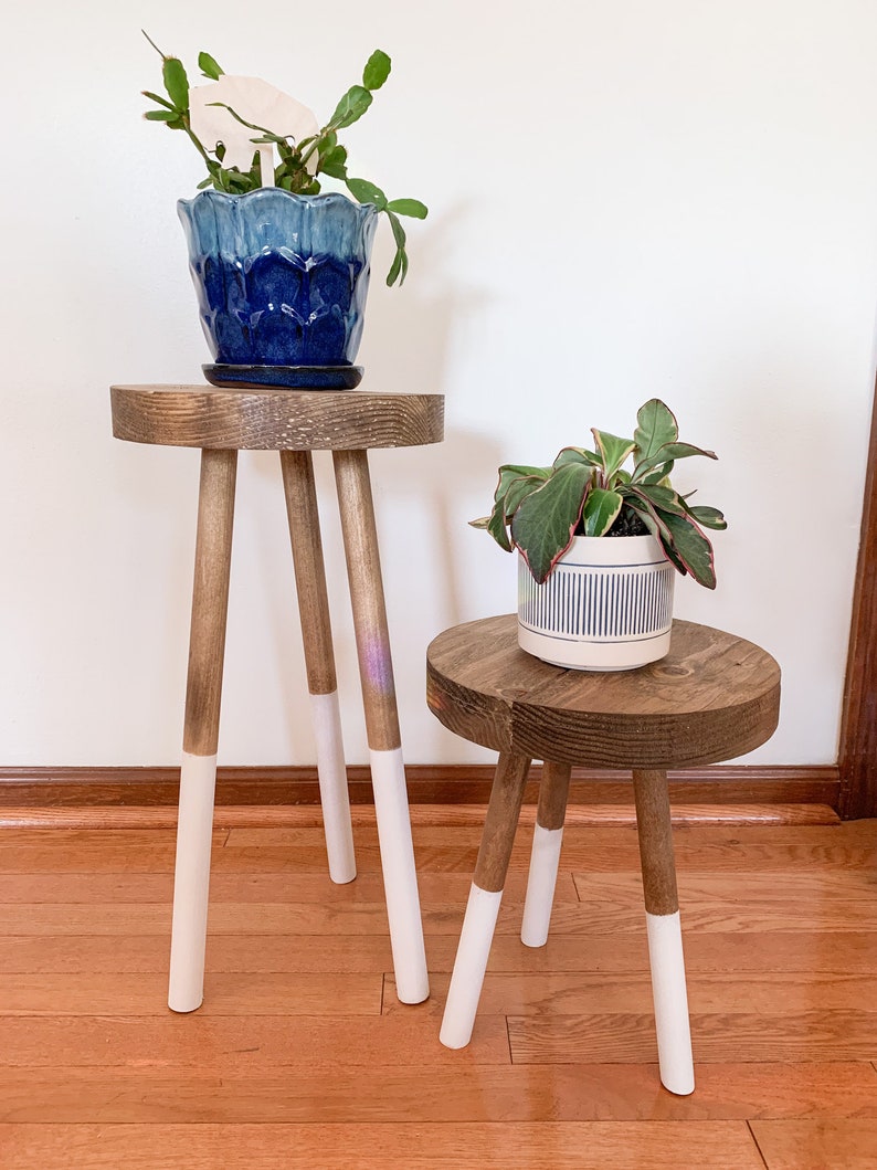 Elevate your decor with our modern wood plant stand – a versatile three-leg accent stool that doubles as an indoor plant stand. The perfect fusion of style and functionality for your space.