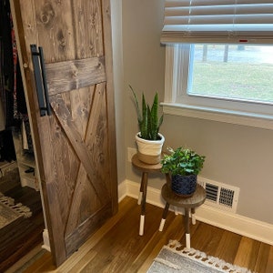 Introducing our modern three-leg wood plant stool, a versatile indoor plant stand that complements your decor effortlessly. This functional wood stool is a stylish addition to your indoor plant display.