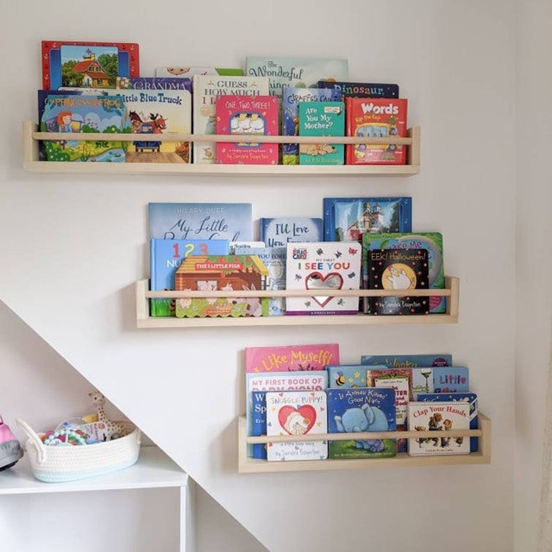 Versatile nursery bookshelf for stylish nursery decor and organization. Gender-neutral, Montessori-inspired design complements any nursery room, while the natural wood finish pairs beautifully with nursery wallpapers and wall art.