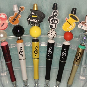 Muziekinstrumenten/spelers pennen met kralen