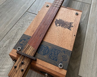 Royal Lion's Axe (Undercrown - Drew Estate)  - 3 String Cigar Box Electric Guitar, Fretted Bubinga fretboard with a Zebrawood Tail