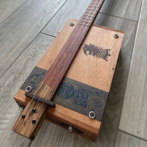 Royal Lion&#39;s Axe (Undercrown - Drew Estate)  - 3 String Cigar Box Electric Guitar, Fretted Bubinga fretboard with a Zebrawood Tail