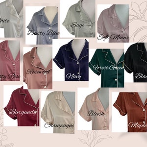 May include: A collection of 14 satin pajamas in various colors, including white, sage, dusty blue, soft mauve, forest green, rosewood, dusty rose, navy, black, burgundy, blush, champagne, and maple.