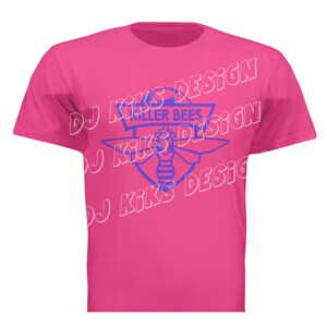 May include: A bright pink t-shirt featuring a blue graphic of a bee inside a shield with the words "KILLER BEES" above it. The shirt also has the text "DJ KIKS DESIGN" in a repeating pattern.