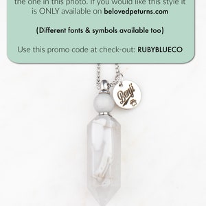 May include: A silver necklace with a white crystal pendant and a silver charm with the name "Benji" engraved on it. The necklace is on a white background. The text "I also offer engraving instead of handstamping like the one in this photo. If you would like this style it is ONLY available on belovedpeturns.com (Different fonts & symbols available too) Use this promo code at check-out: RUBYBLUECO" is at the top of the image.