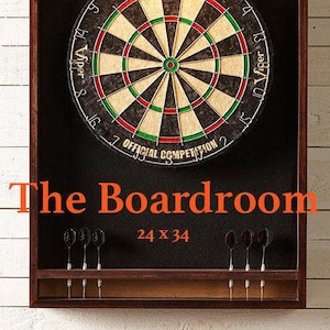 Custom dartboard cabinet with mahogany finish Includes foam backer, dartboard, darts, LED light and will ship for free.