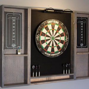 Gray weathered wood dartboard cabinet It comes as a complete set. Dartboard, darts, led light w/ dimmer and remote.