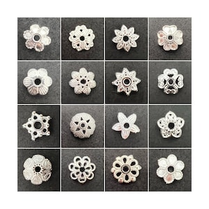 May include: Assortment of 15 silver metal flower-shaped bead caps. Each cap has a different design with intricate details. The caps are perfect for adding a touch of elegance to jewellery making projects.