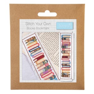May include: A cross-stitch kit for a bookmark featuring a stack of colourful books. The packaging is brown cardboard with the text Stitch Your Own Books Bookmark and Trimits. The kit includes a white fabric strip with a finished book design.
