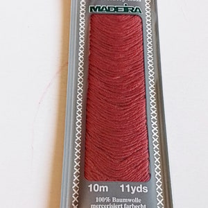 single skein of madeira mouline 100% Egyptian cotton hand embroidery floss shade 2502. Red embroidery thread.