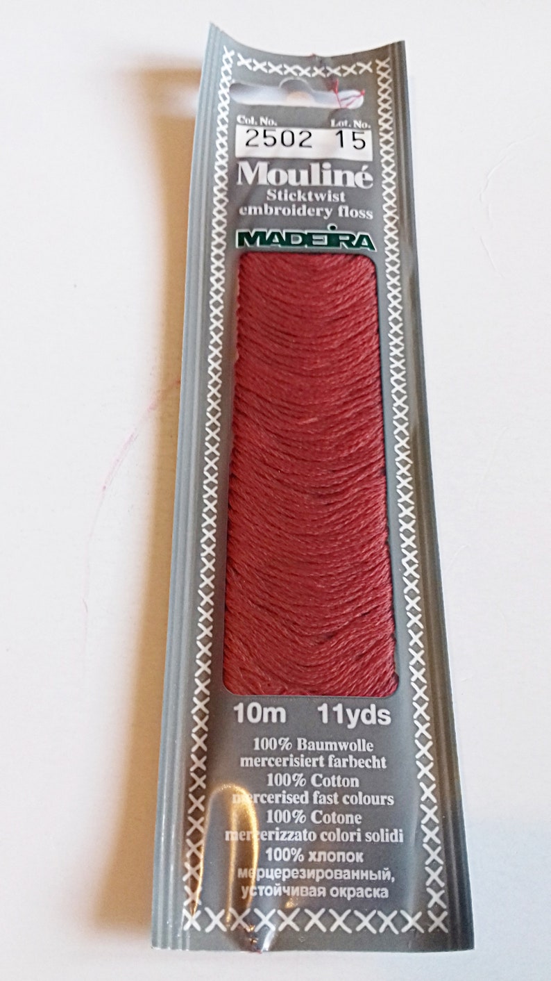 single skein of madeira mouline 100% Egyptian cotton hand embroidery floss shade 2502. Red embroidery thread.