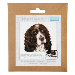 May include: A brown and white dog cross stitch kit with the name "Barney" on the front. The kit includes everything you need to create a small cross stitch of a dog's head.