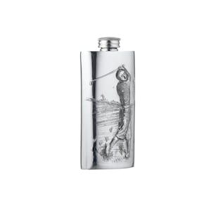 May include: A rectangular silver-coloured metal flask featuring an embossed design of a golfer in mid-swing on a course. The flask has a smooth, reflective surface and a screw-top cap at the centre of the top edge, providing a secure closure.