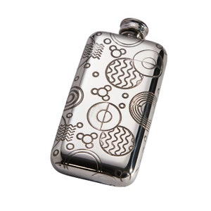 May include: A silver hip flask with a geometric pattern engraved on the surface.