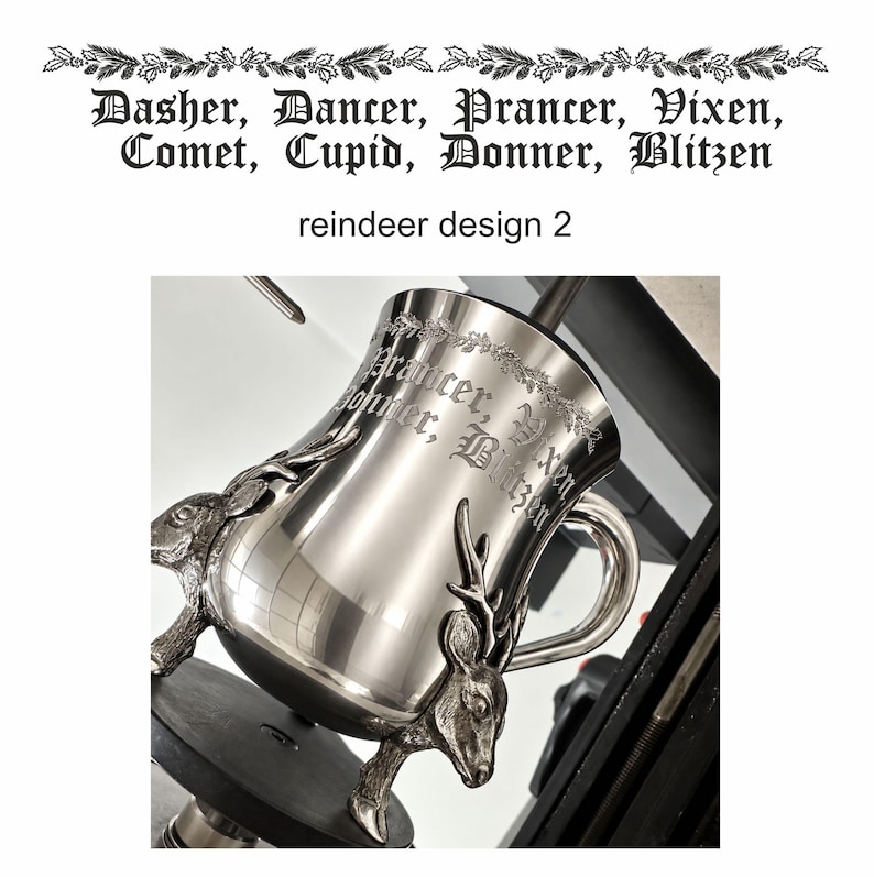 May include: A polished silver-toned metal mug featuring two sculpted reindeer heads as decorative accents at the base. The surface is engraved with the text "Prancer, Vixen, Donner, Blitzen" in a gothic font, framed by a delicate etched garland.