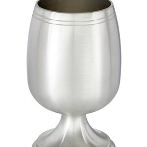 May include: A silver goblet with a rounded bowl and a stemmed base. The goblet has a smooth, polished surface and a wide opening. The base is circular and provides stability. The design is simple and elegant, suitable for various beverages.