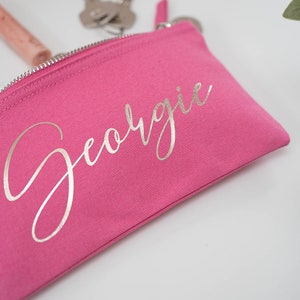 Pink cotton canvas make up bag with a sturdy zip and  personalisation in a silver foil.