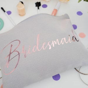 Cream cotton canvas make up bag with a sturdy zip and personalisation in a rose gold foil.