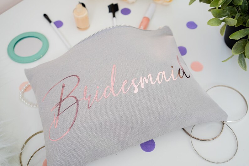 Cream cotton canvas make up bag with a sturdy zip and personalisation in a rose gold foil.